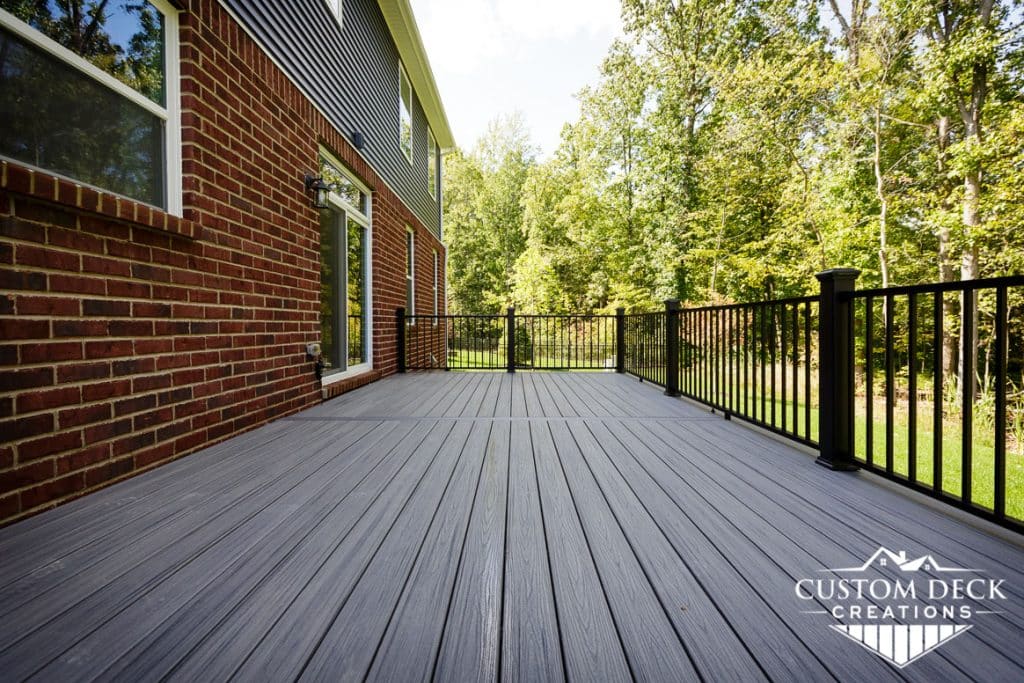 Looking down parallel with the boards of a backyard deck