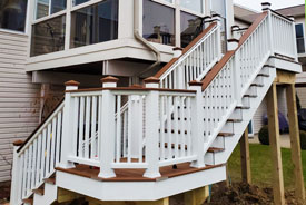 exterior view of a custom built deck staircase by custom deck creations