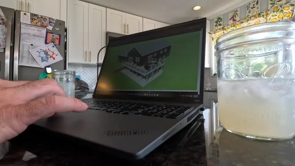 Design Consultant reviewing a 3D deck design with homeowners